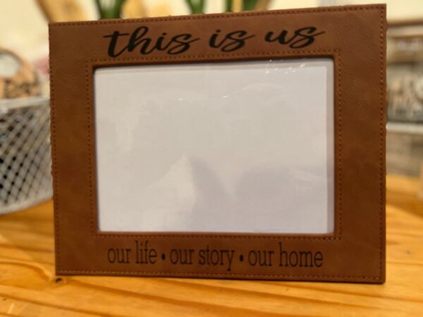 Product image and link for  Ready to Ship Engraved Leatherette 5×7 Picture Frame (This Is Us… our life..our story..our home